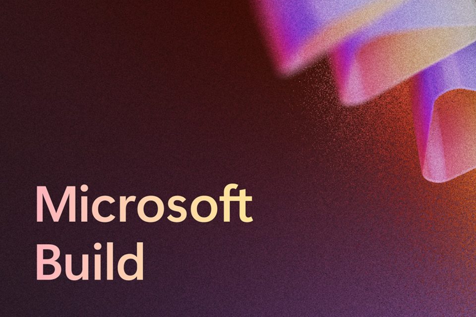 Texto Microsoft Build 2025 junto a formas triangulares abstractas