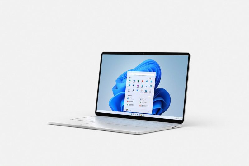 Photo of a laptop with Windows 11 desktop rendered on the screen