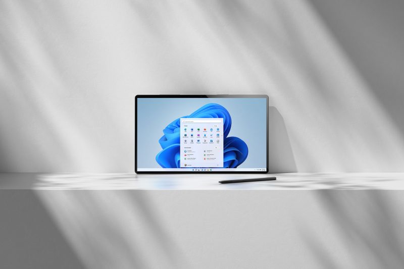 Photo of tablet device with Windows 11 desktop rendered on screen