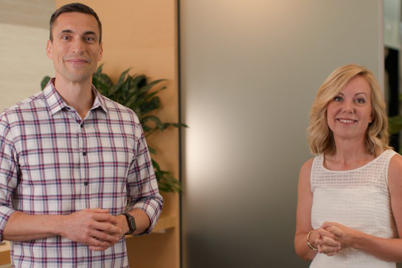 Jared Spataro and Alysa Taylor standing in a room smiling