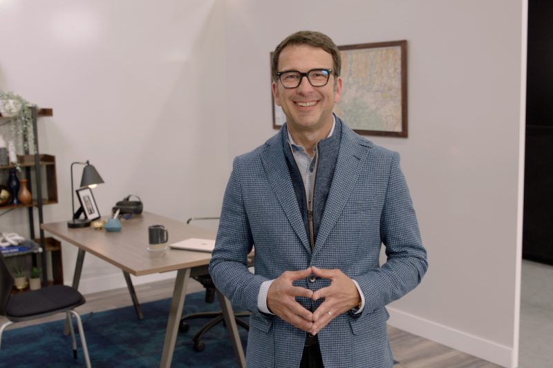 Judson Althoff standing in a room smiling