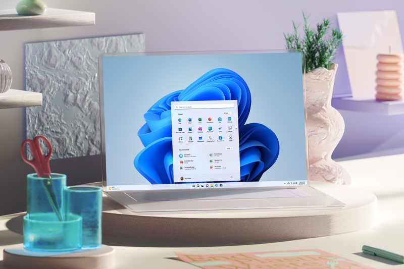 Windows 11 2022 update with the Start Menu showing on a laptop sitting on top of a desk.