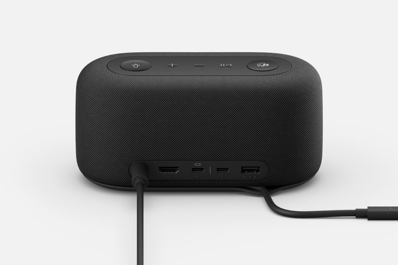 The back of the dock shows connections for different accessories with two cables running from the dock.