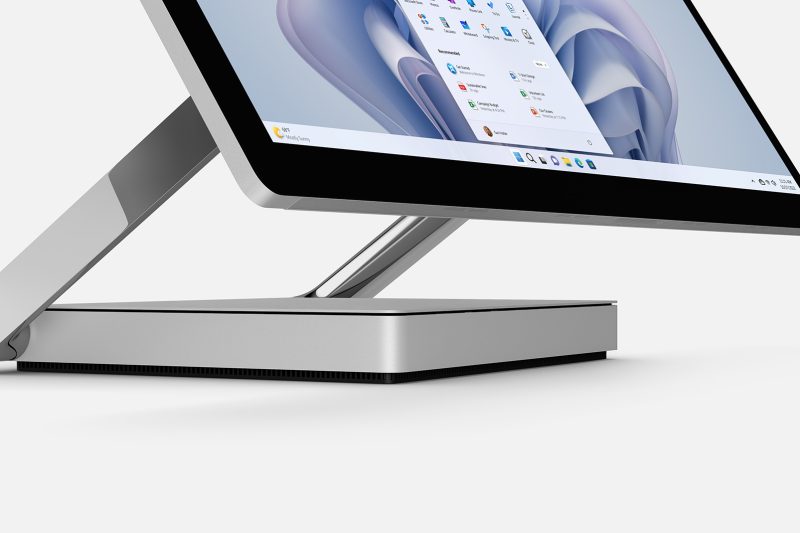 An all-in-one computer shows the weather and start menu.