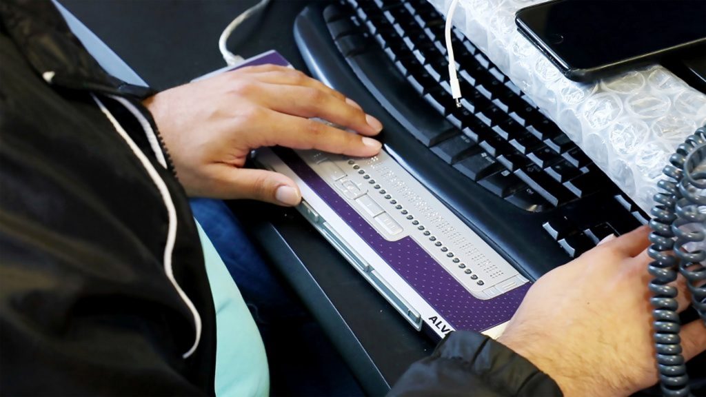 Aj-Using-Braille-Display-1920x1080px