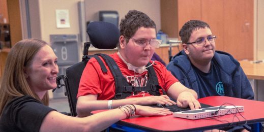 young man in wheelchair uses Adaptive Controller