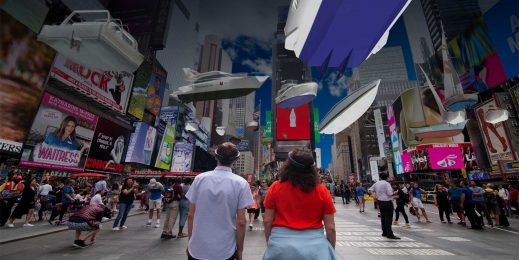 Two people in Times Square look at billboards using HoloLens
