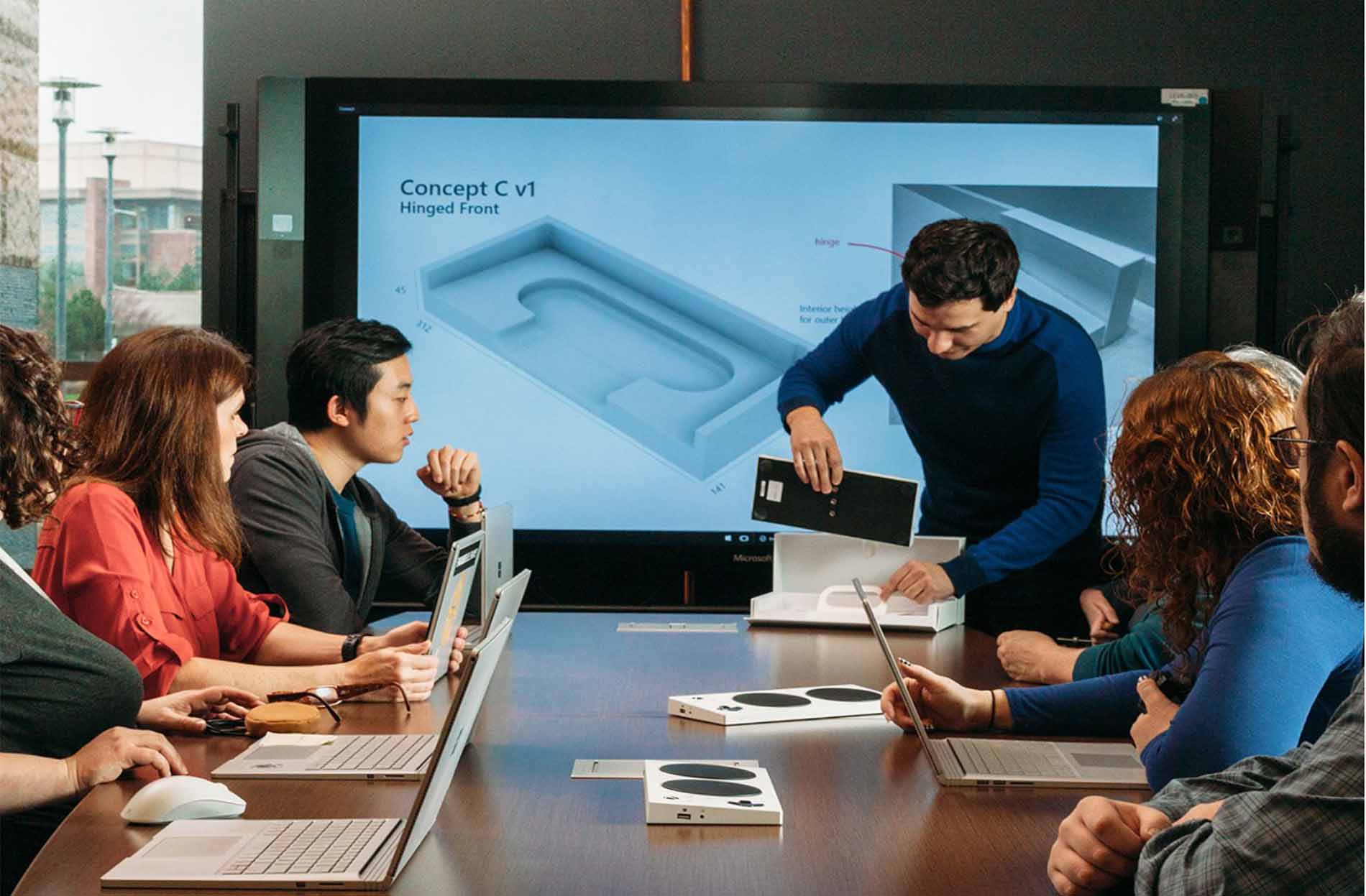 Designer Mark Weiser, standing, created the unique packaging for the controller.