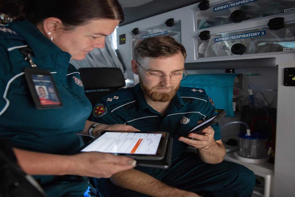 ambulance workers collaborating on teams