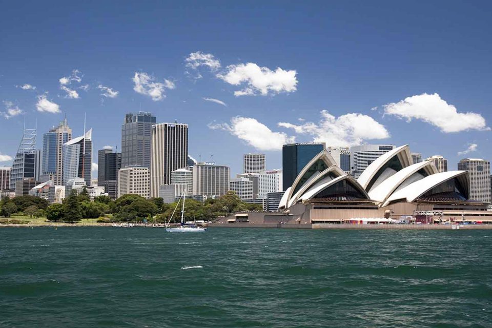 Sydney Opera House in Sydney Harbor with downtown skyline, Sydney, New South Wales, Australia