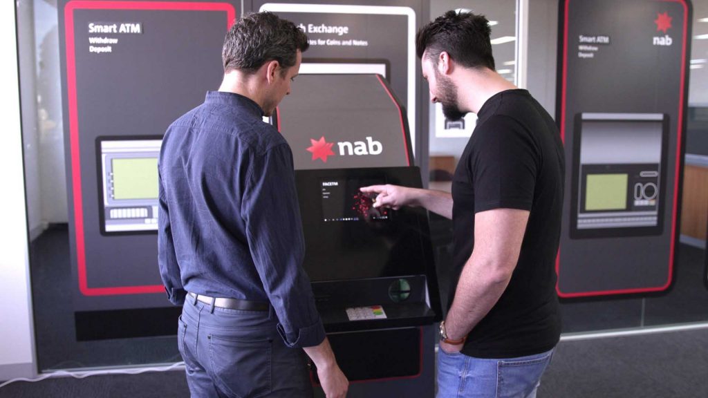 two men using a NAB ATM