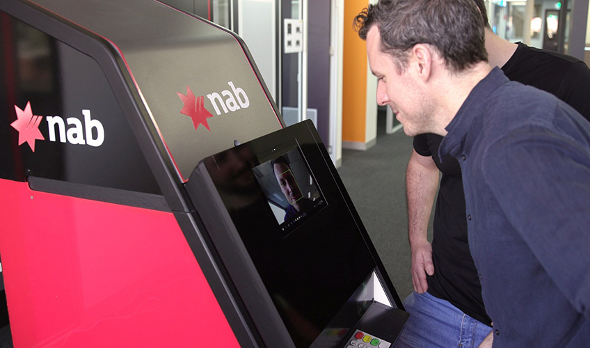 man using a NAB atm