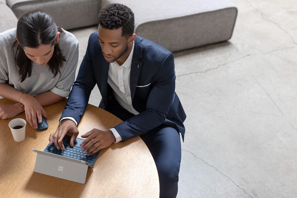 man and woman use surface go 4g