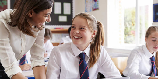 A teacher supervising her students.