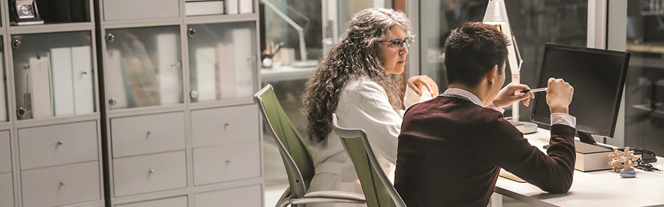 Two medical professionals sharing a desk