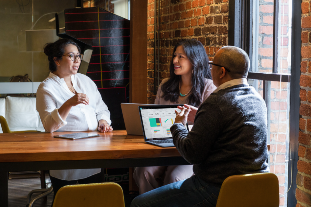 Image of colleagues taking a meeting