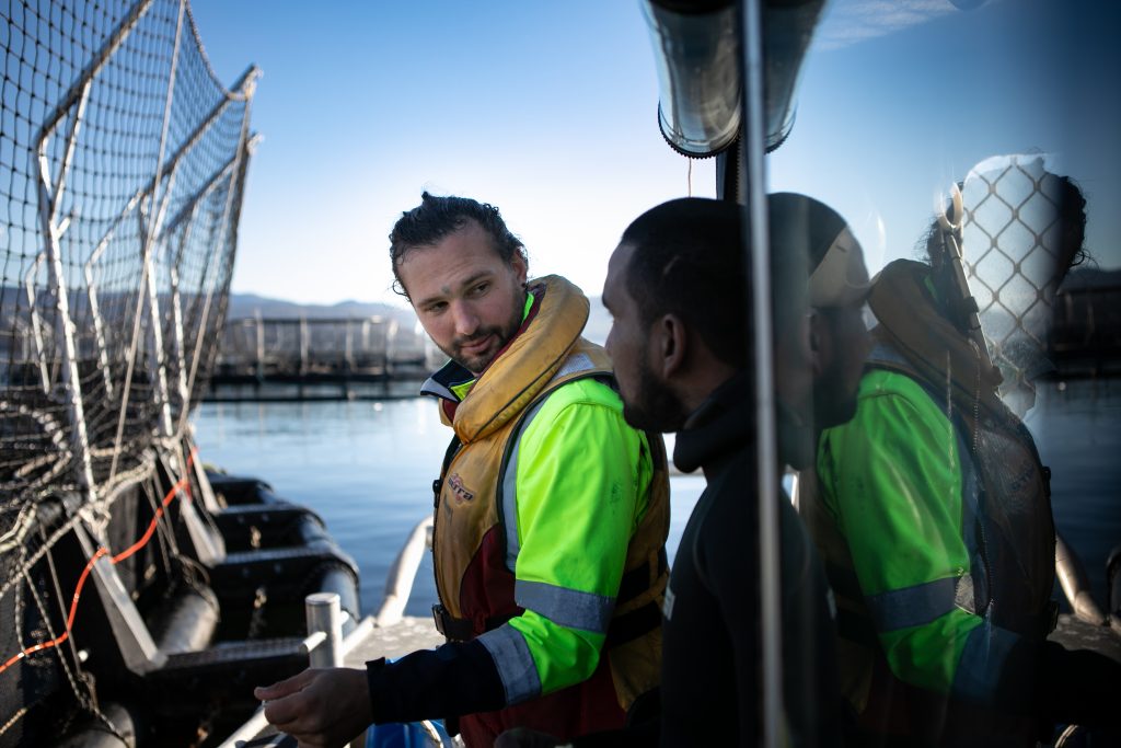 Salmon farmer on a boat
