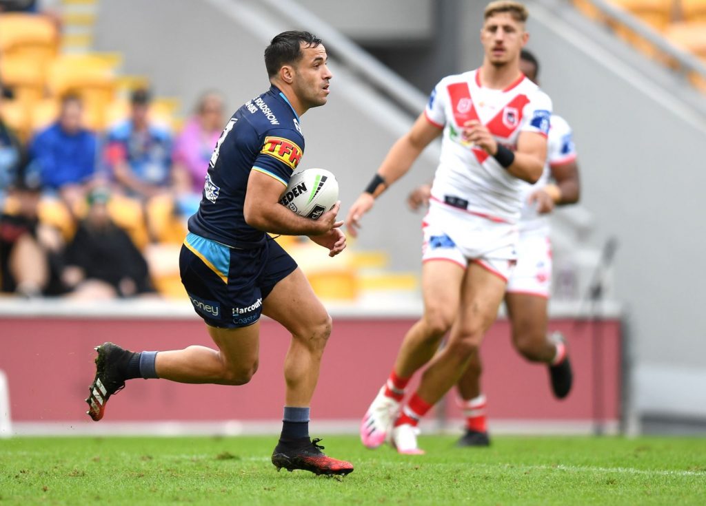 Two NRL footballers on the field