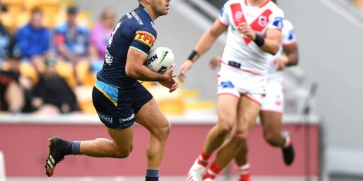 Two NRL footballers on the field