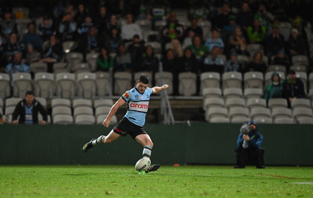 NRL Rugby player kicking a ball