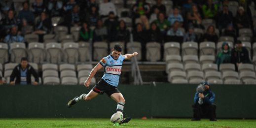 NRL Rugby player kicking a ball