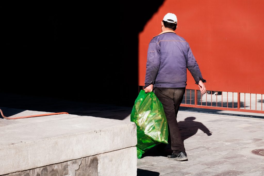 Man holding rubbish bag