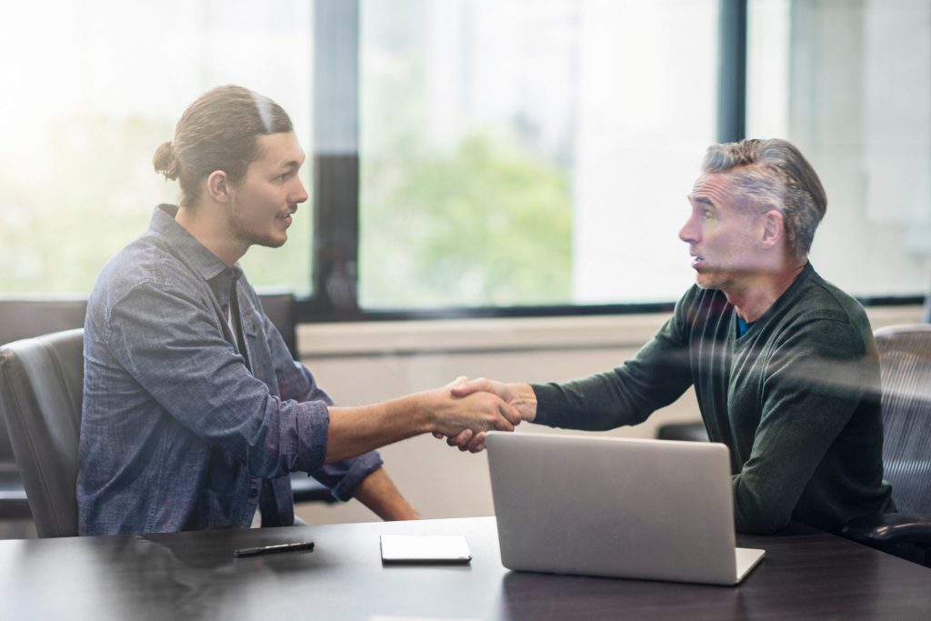 Two males shaking hands