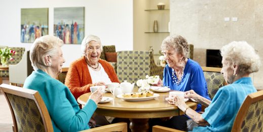Group of elderly women sitting around a table