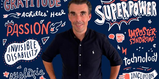 Andrew Lowson standing in front of a navy background with graphical text