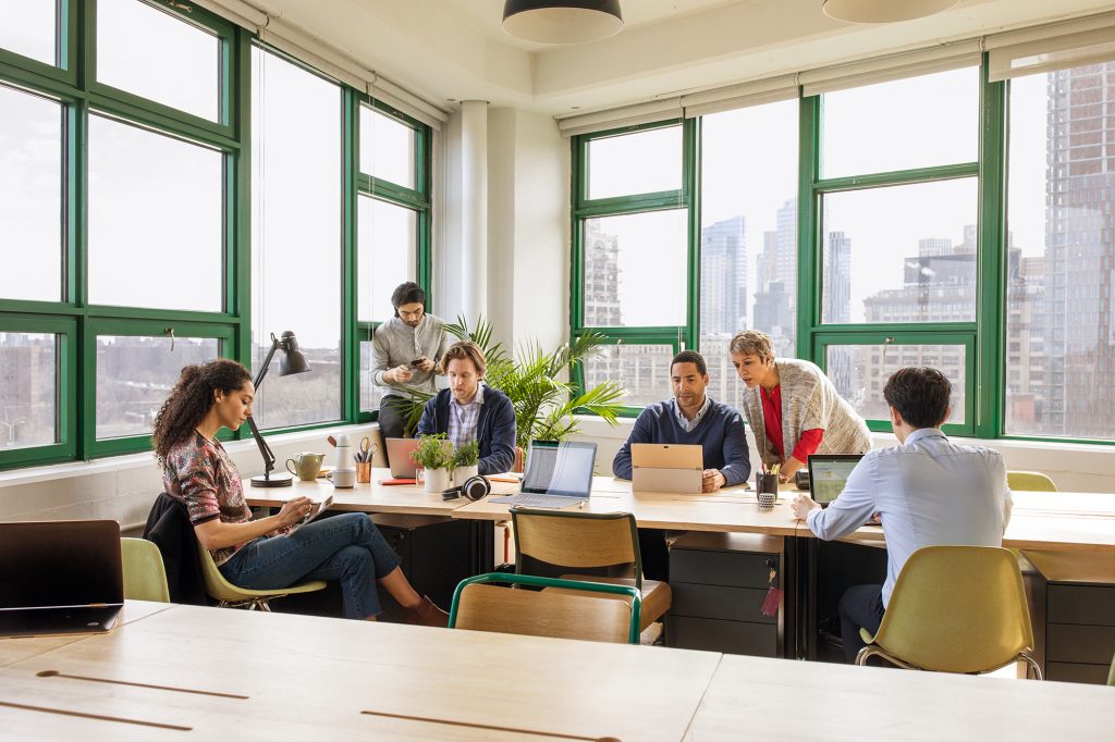 Small business team collaborating in modern workplace.