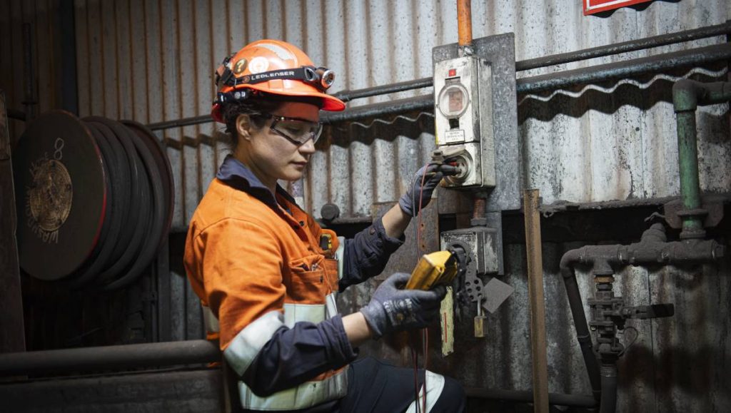 Female worker in safety gear