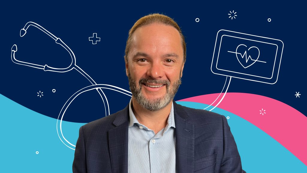 Portrait image of Simon Kos, adult male, infront of graphical background