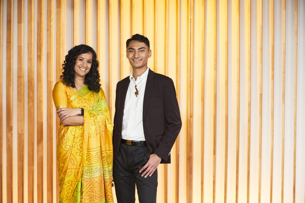 Adult male in a suit and an adult female in a traditional sari dress