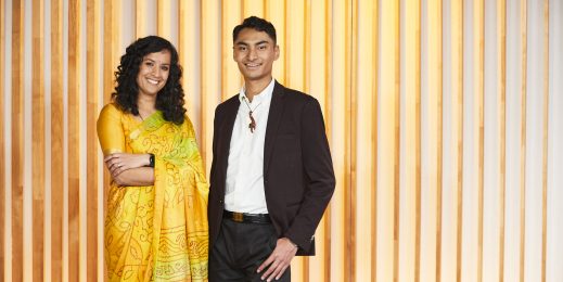 Adult male in a suit and an adult female in a traditional sari dress