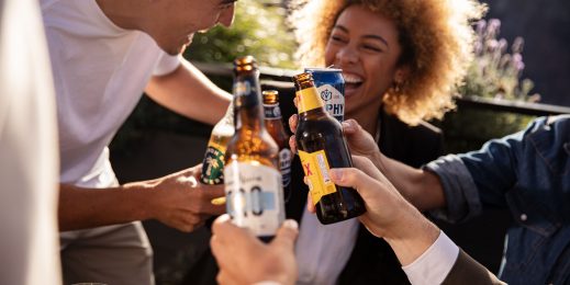 Group of adults holding glasses of alcohol beveraged