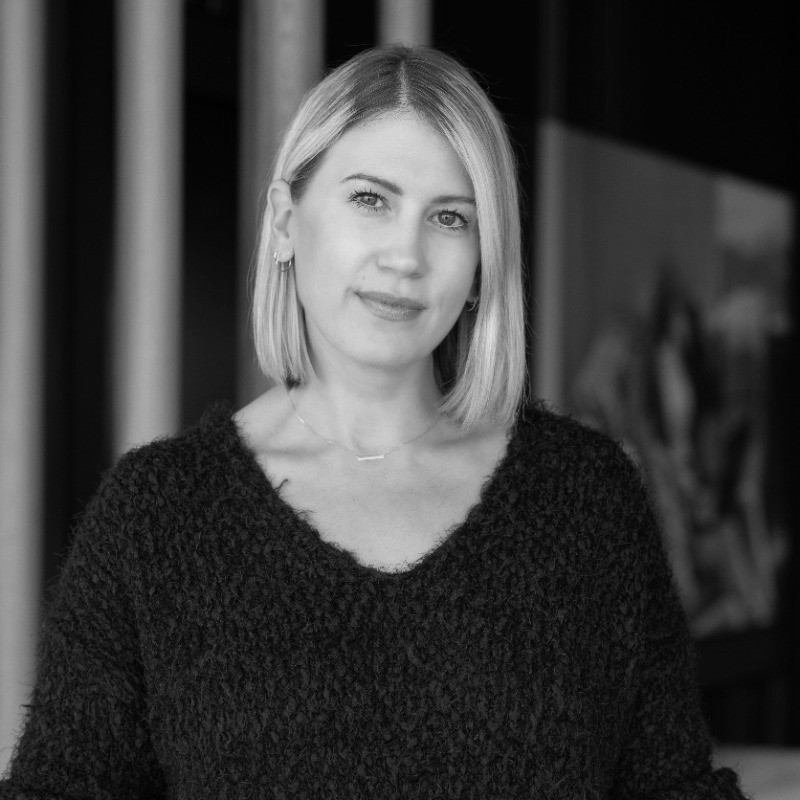 Close up of a woman with a dark sweater