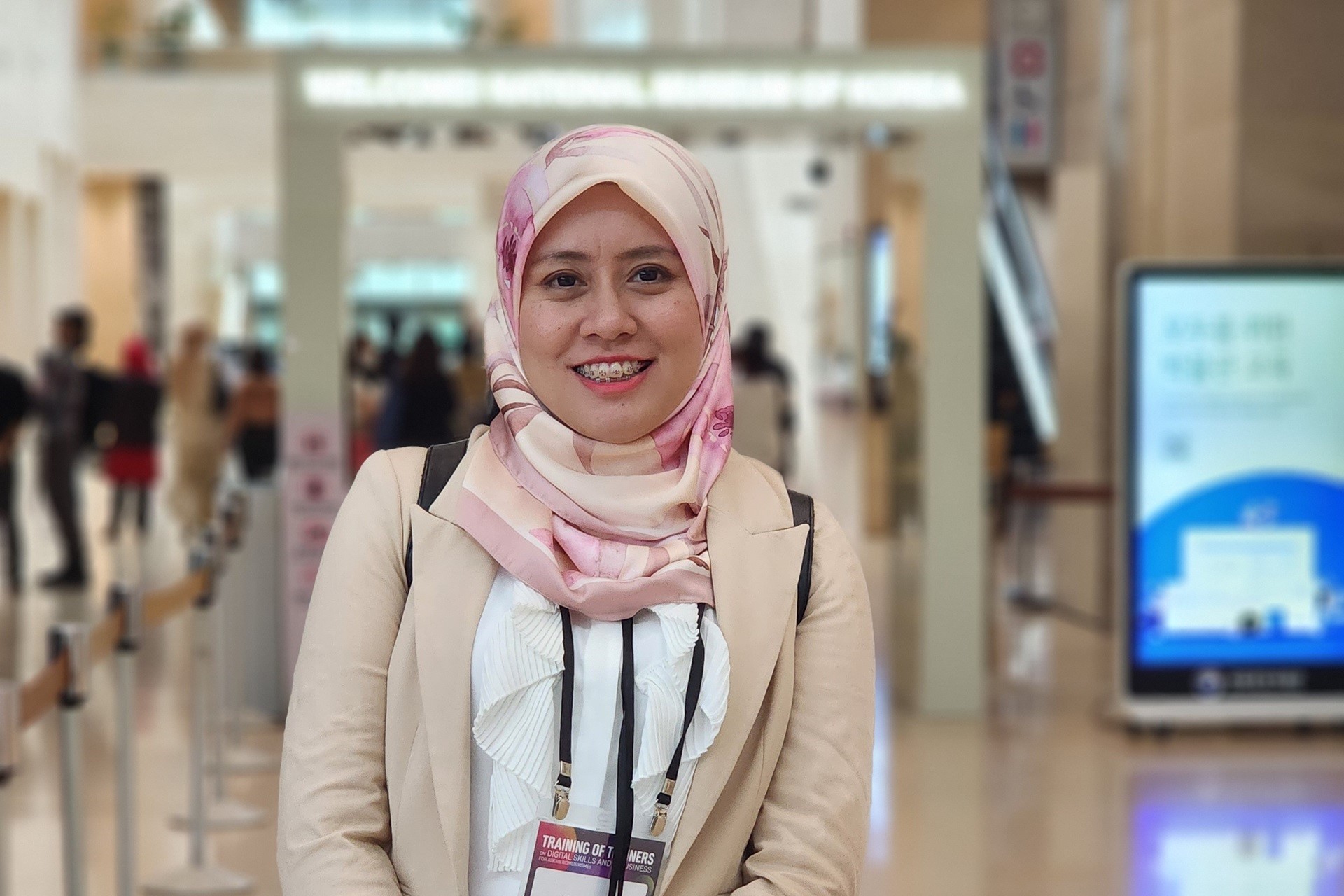 Woman in a headscarf at a conference