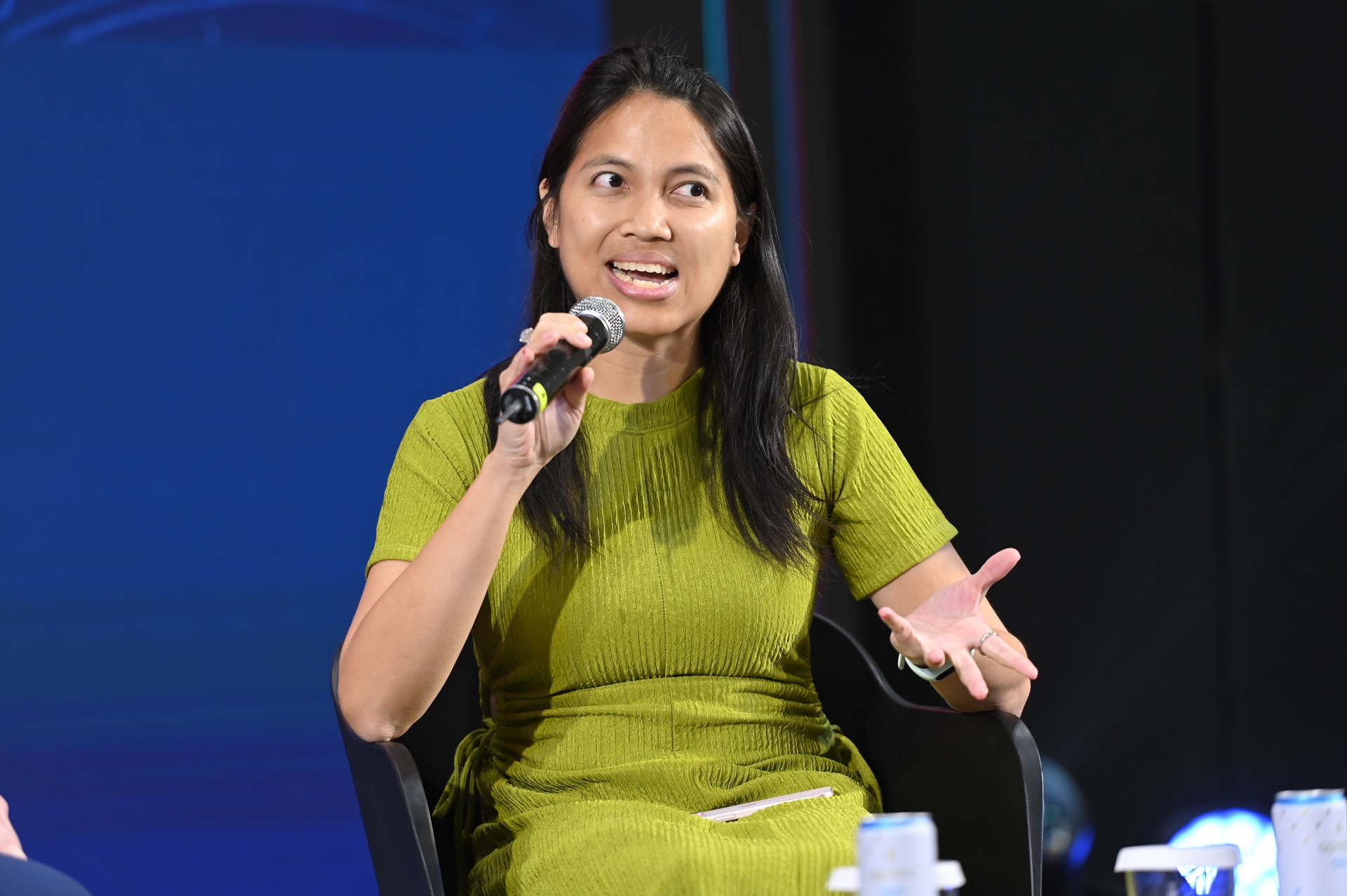 Woman speaking into a microphone