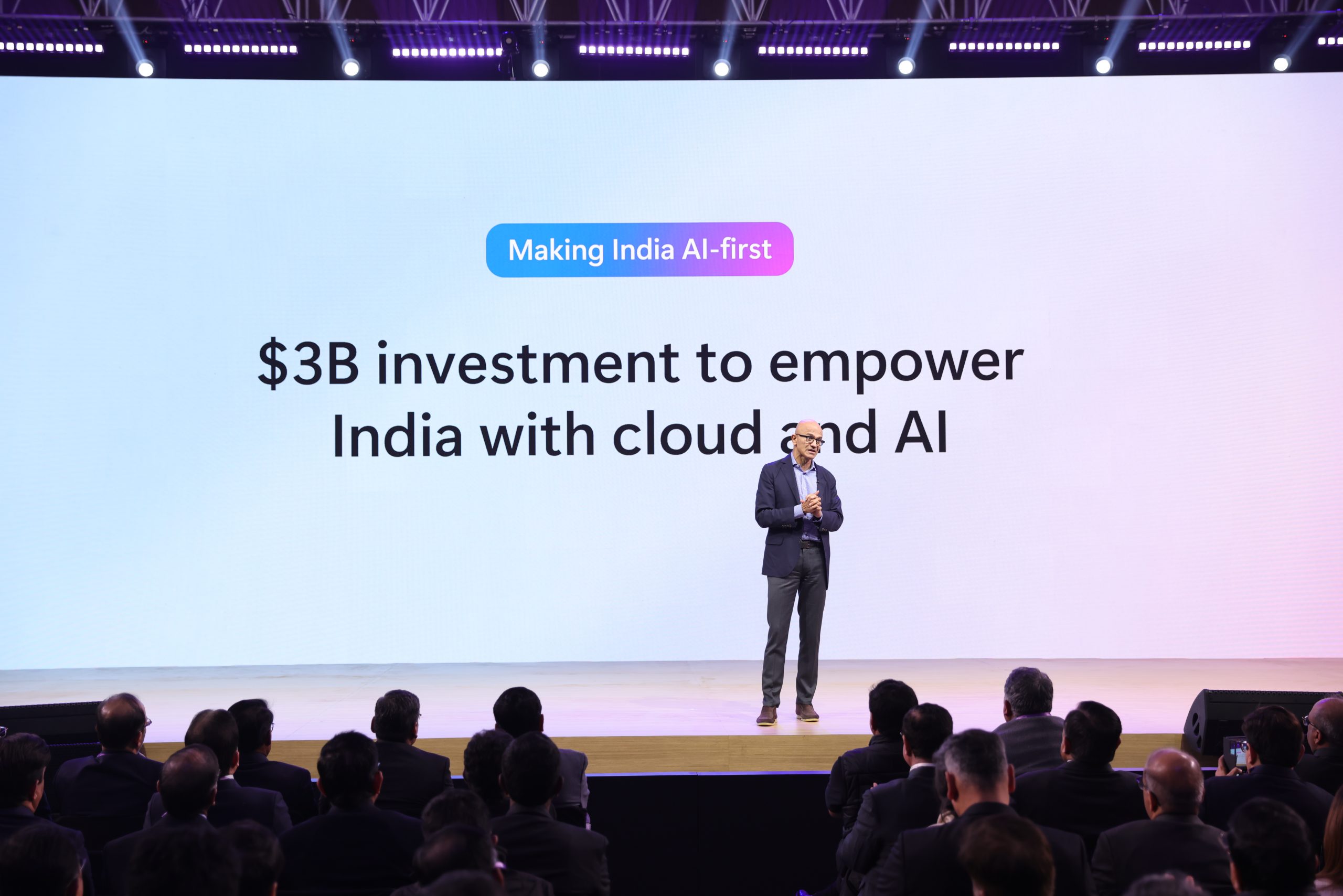man on stage with backdrop that says Making India Ai first