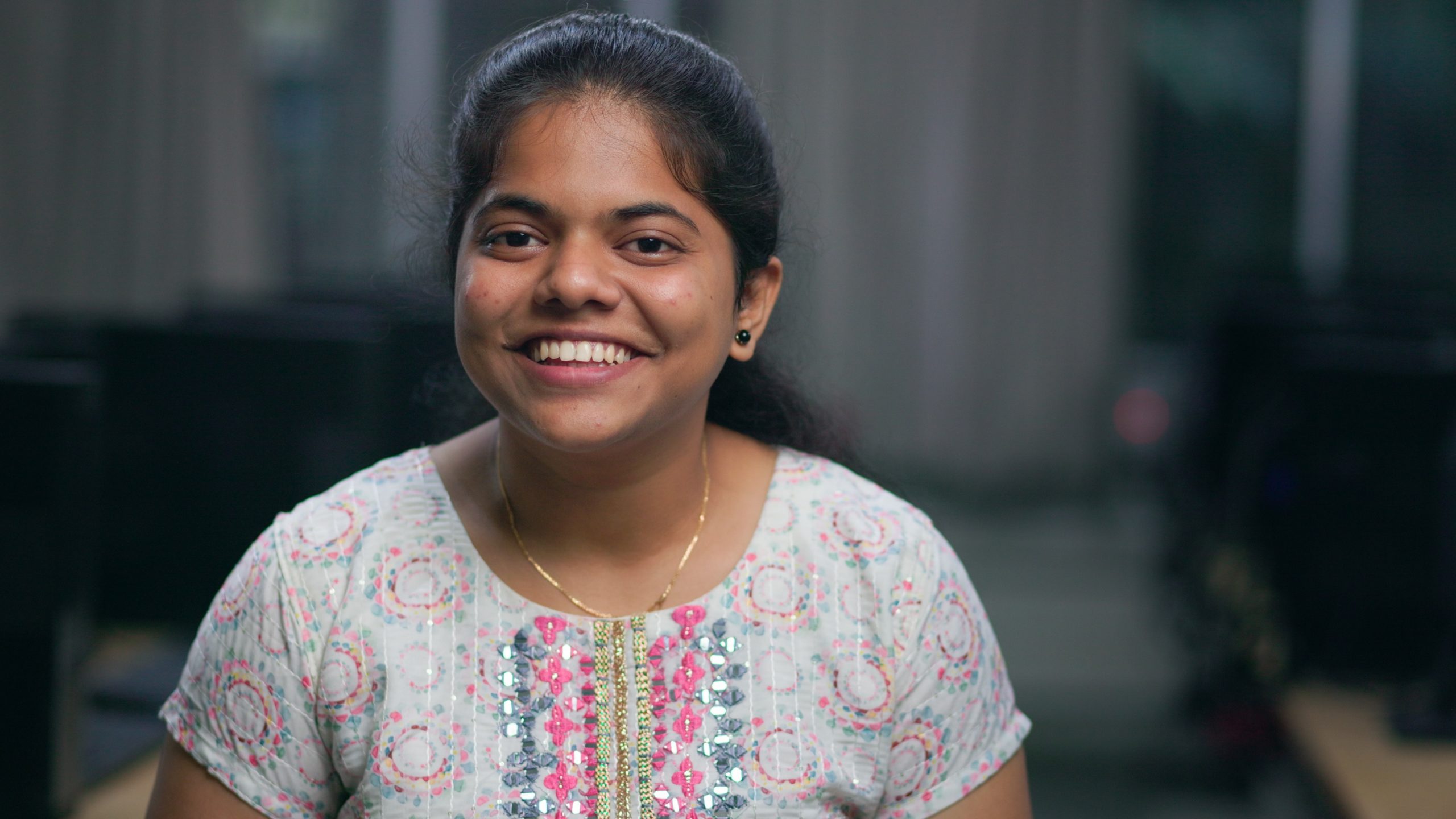 a girl smiling at the camera