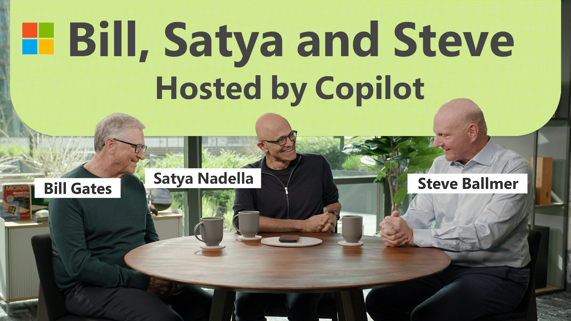 Bill Gates, Satya Nadella and Steve Ballmer sitting around a table.