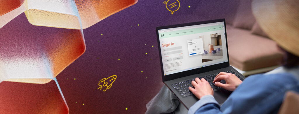 A person sits on a chair with a laptop on the lap, with an Edge browser open; colorful background with shapes