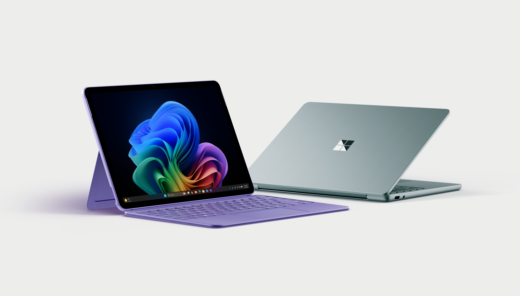 Surface Pro 12-inch in violet with Surface Laptop next to each other