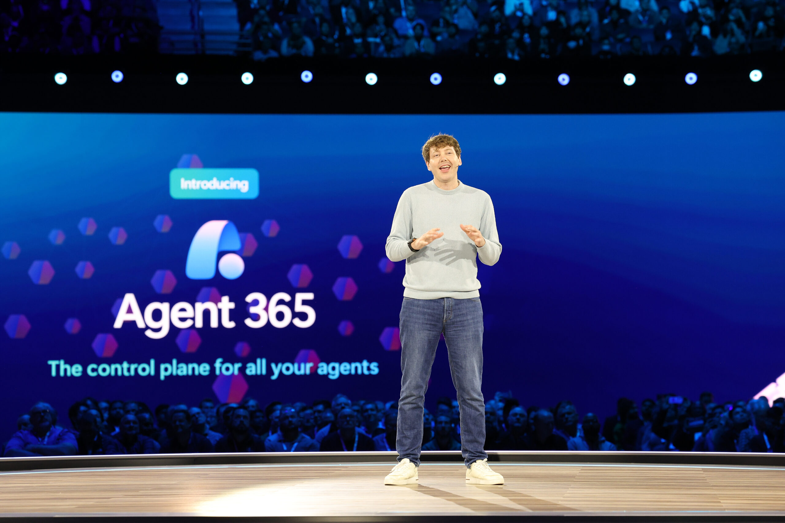 A man onstage at a business event.