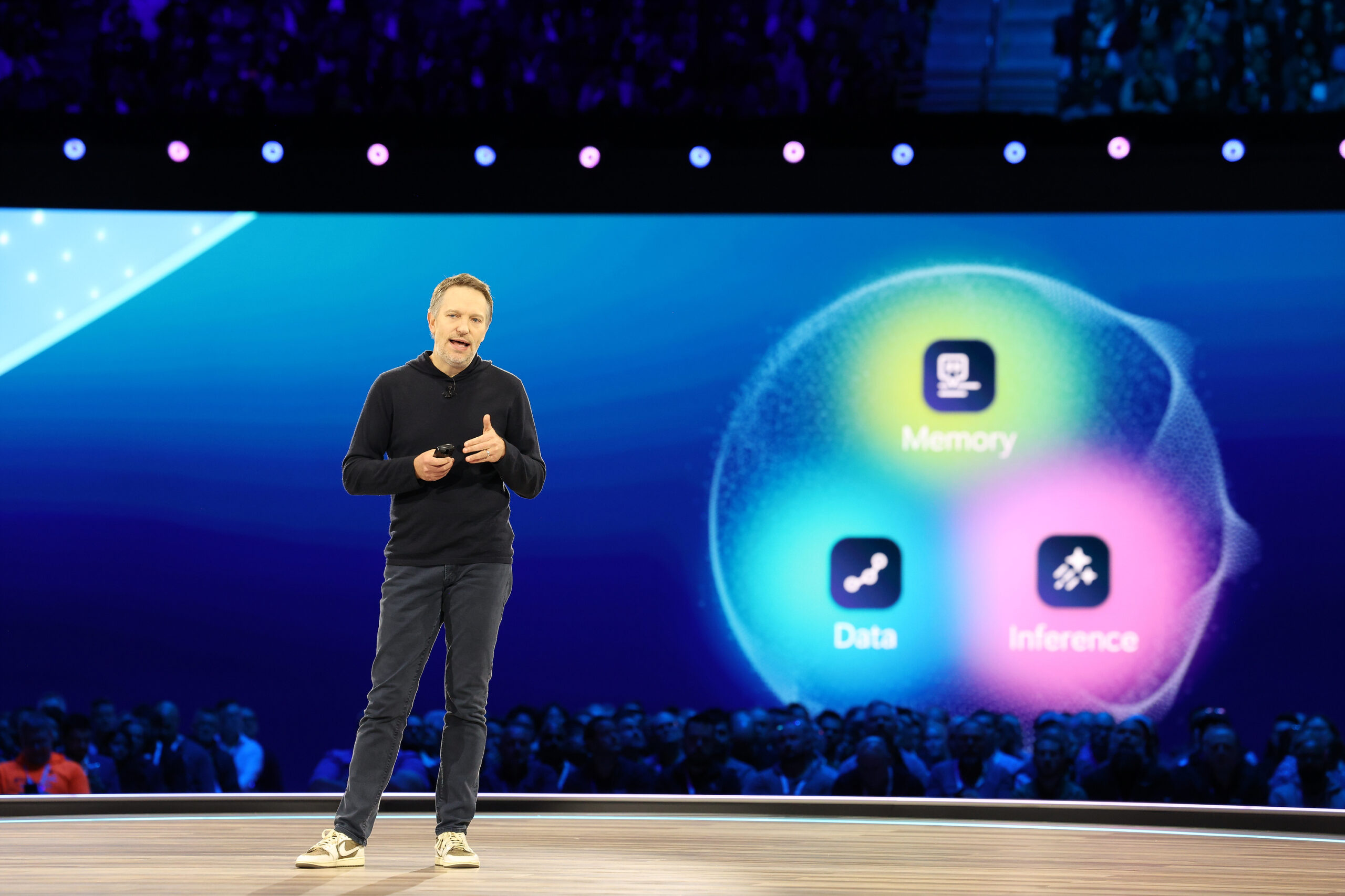 A man onstage at a business event.