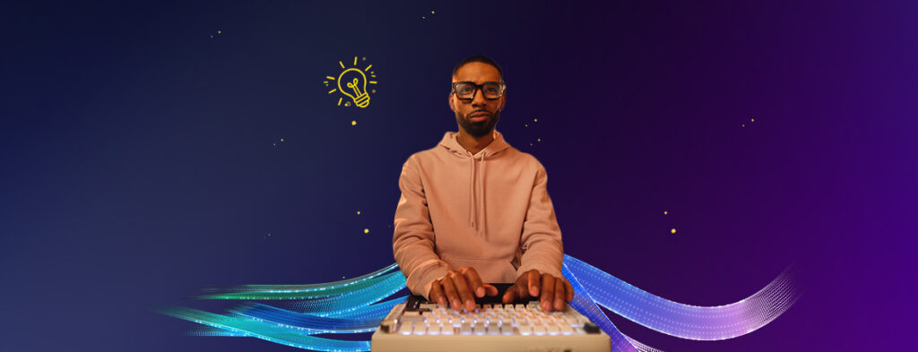A man at a keyboard, on a background of colorful shapes.
