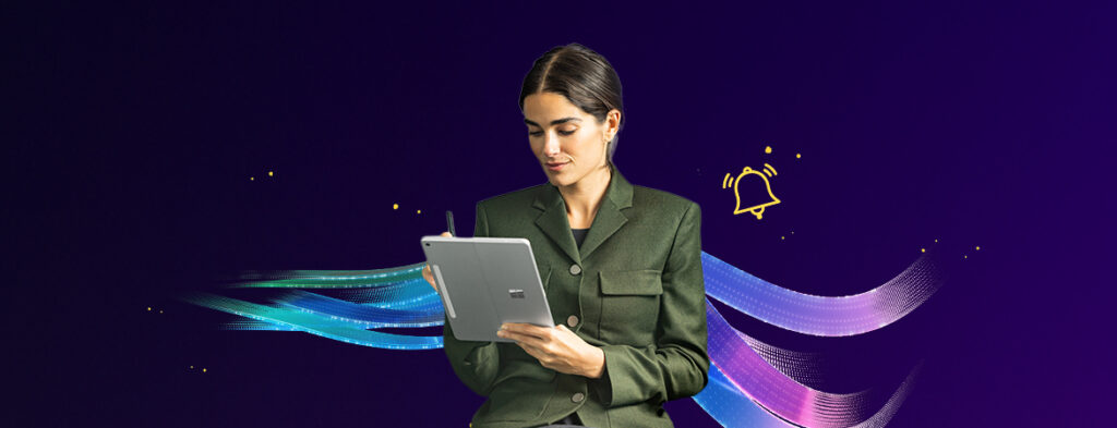 A woman works on a tablet computer with a stylus, on a background of colorful shapes.