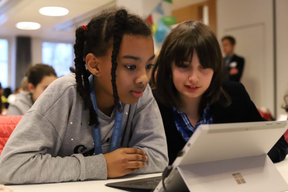 Two girls working on a Surface Pro