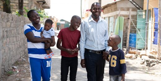Family of five walking down street