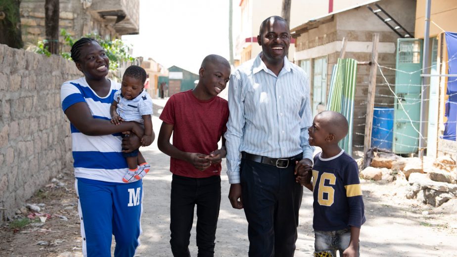 Family of five walking down street